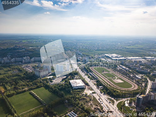 Image of Aerial view landscape of the city of Kiev with a racecourse on a background of blue sky