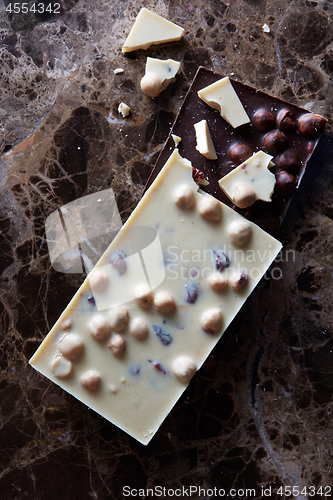 Image of pieces of dark and white chocolate