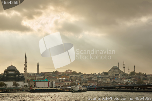 Image of Beautiful scenic seascape landscape with light of sunbeam through clouds to the town