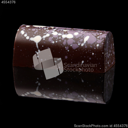 Image of chocolate candy on black background