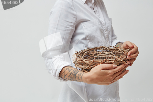 Image of Girl holding a wreath in her hands