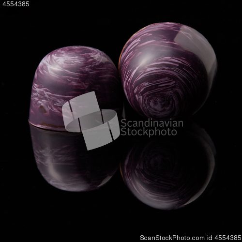 Image of chocolates candies on black background