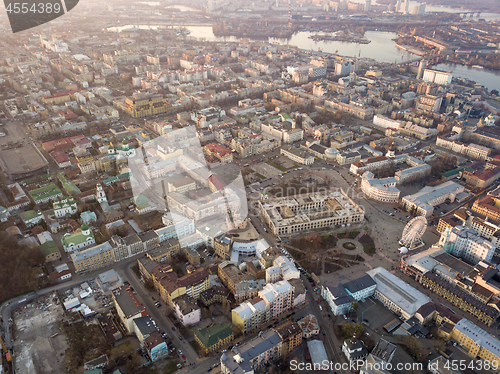 Image of The panoramic bird\'s eye view from drone to the central historical part of the city Kiev - the Podol district, the Dnieper River in Kiev, Ukraine at summer sunset.