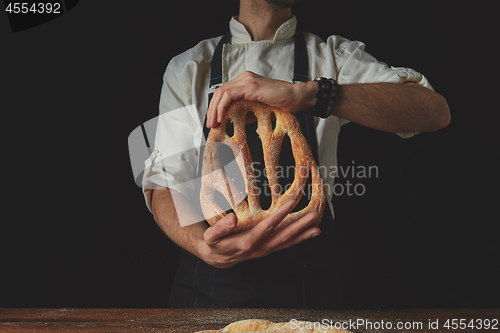 Image of Baker holding fougas bread