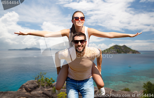 Image of happy couple having fun on seychelles island