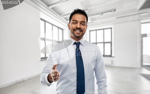 Image of businessman or realtor giving hand for handshake