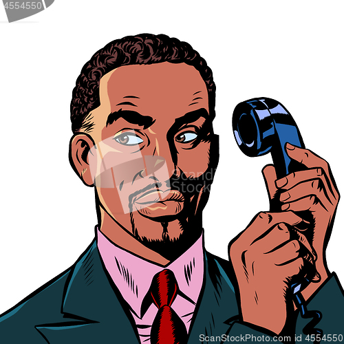 Image of serious african man talking on a retro phone. isolate on white background