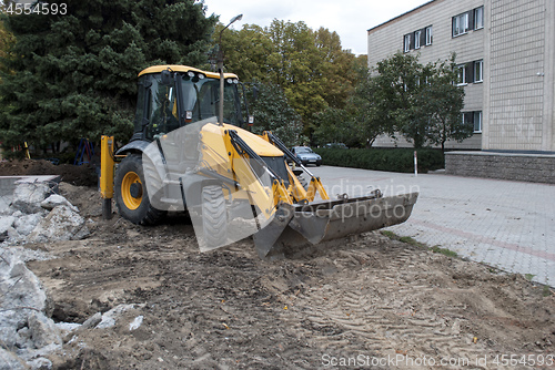 Image of excavator stands on a construction site