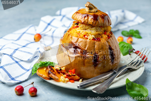 Image of Pumpkin baked with couscous and vegetables.