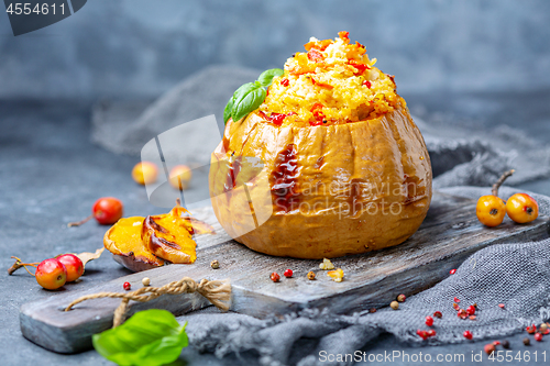 Image of Baked pumpkin stuffed with couscous and vegetables.