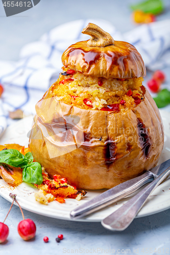 Image of Pumpkin stuffed with couscous and fried vegetables.