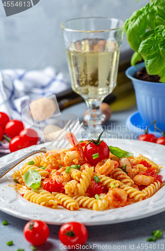 Image of Pasta with tomato sauce and shrimp.