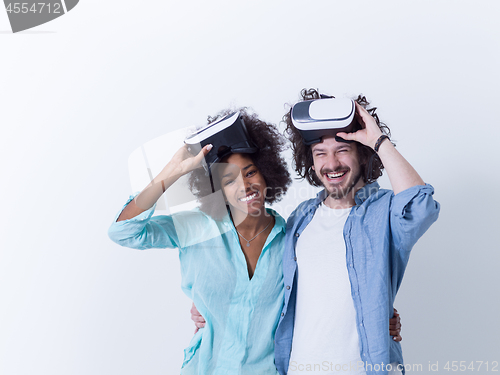 Image of multiethnic couple getting experience using VR headset glasses