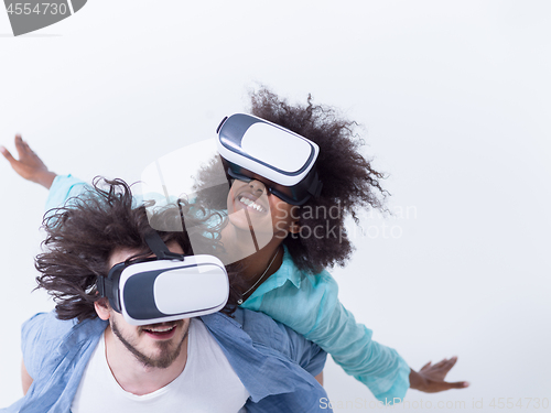 Image of multiethnic couple getting experience using VR headset glasses