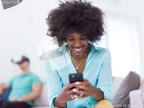 Image of Multiethnic Couple using virtual reality headset