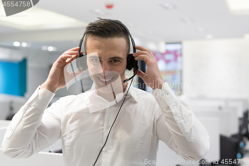 Image of male call centre operator doing his job