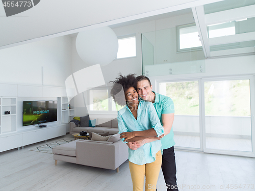 Image of multiethnic couple hugging