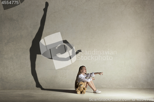 Image of Baby girl dreaming a dancing ballet on the stage. Childhood concept.