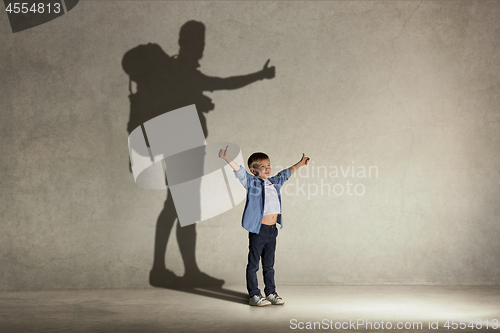 Image of The little boy dreaming about tourism