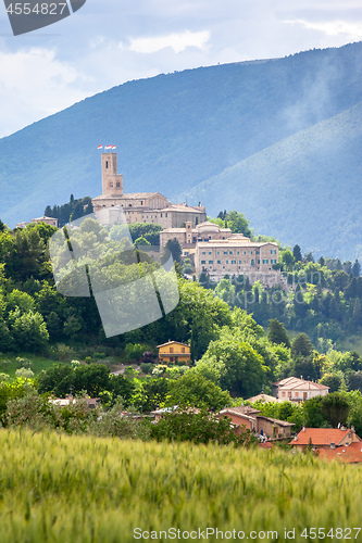 Image of Camerino in Italy Marche over colourful fields