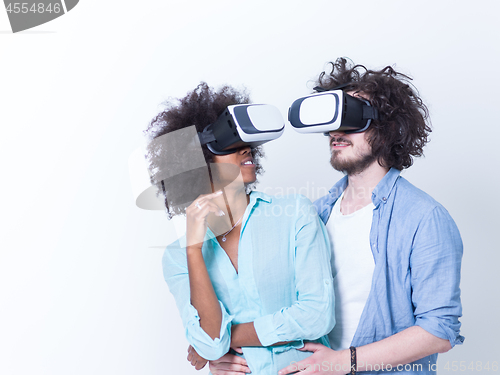 Image of multiethnic couple getting experience using VR headset glasses