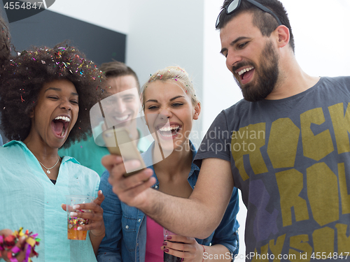 Image of confetti party multiethnic group of people isolated over gray