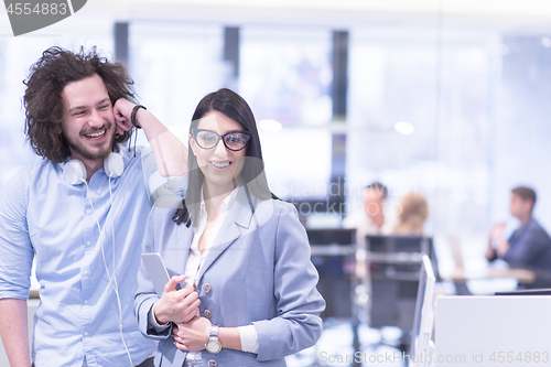 Image of Business People Working With Tablet in startup office