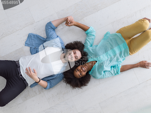 Image of top view 0f Cheerful young multiethnic couple