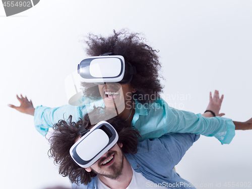 Image of multiethnic couple getting experience using VR headset glasses