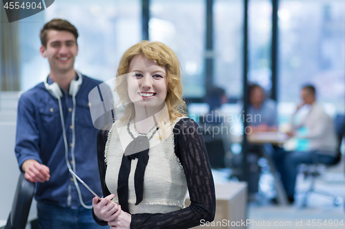 Image of Business People Working With Tablet in startup office