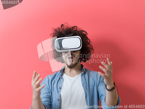 Image of young man using VR headset glasses of virtual reality