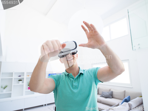 Image of man using VR-headset glasses of virtual reality