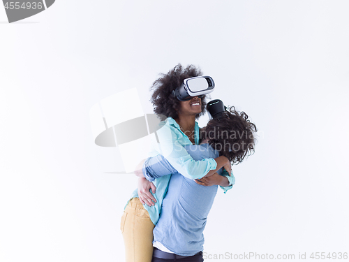 Image of multiethnic couple getting experience using VR headset glasses