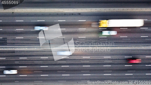 Image of Aerial view road with passing cars blurred background. Photo from the drone