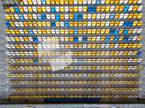 Image of KYIV, UKRAINE - July 19, 2018. Top view of empty tribunes of NSC Olimpiysky in blue and yellow colors before the game.