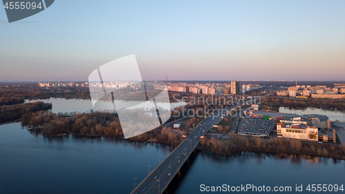 Image of Dnieper river with bridge, Shopping center Skymol, parking and Truhaniv island from above in Kyiv, Ukraine