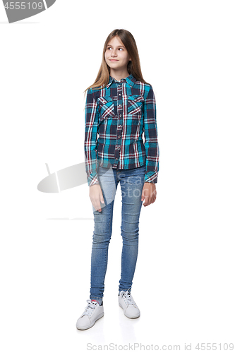 Image of Teen girl in checkered shirt standing casually