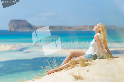 Image of Relaxed Happy Woman Enjoying Sun on Vacations.