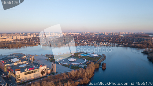 Image of Ukraine, Kiev, April 8, 2018. The Shopping Center SkyMall and Sky Family Park and Desenka Gulf, a bird\'s eye view, aerial panoramic view from drone at sunset in the summer.