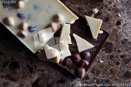 Image of pieces of dark and white chocolate