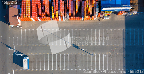 Image of Ukraine, Kyiv. April 08, 2018: Aerial view, from the drone to the warehouse with a lot of different building materials and parking with a truck sunny day. Top view.