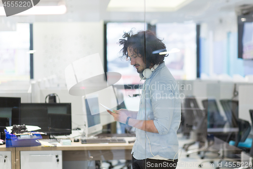 Image of businessman using tablet computer