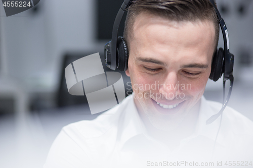 Image of male call centre operator doing his job