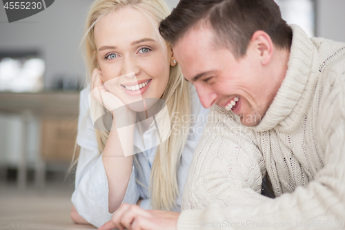 Image of Young Couple using digital tablet on cold winter day