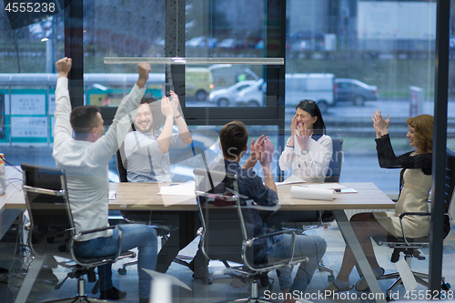 Image of startup Group of young business people celebrating success