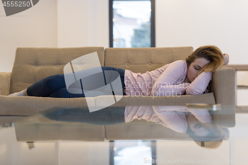 Image of Woman Sleeping On Sofa