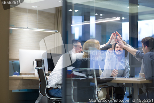 Image of startup Group of young business people celebrating success