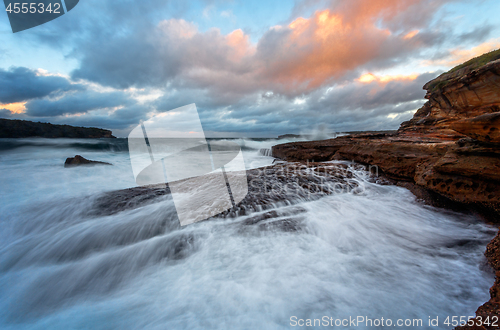 Image of Waves crash onto the rocky shore of Bare Island