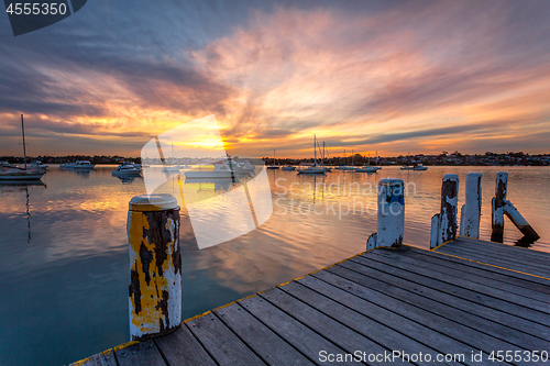 Image of Yachts andl boats moored on tranquil waters 