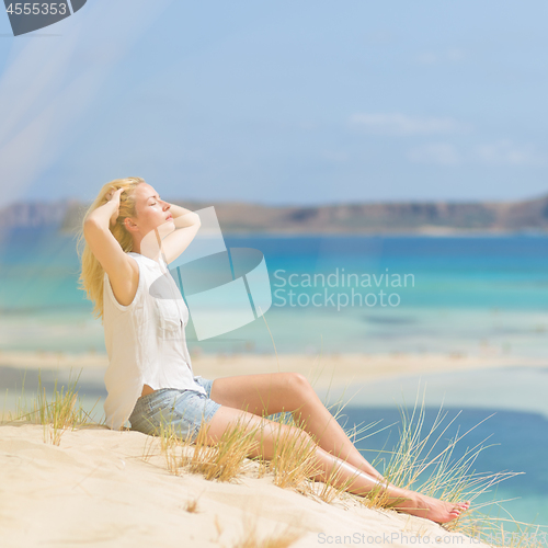 Image of Relaxed Happy Woman Enjoying Sun on Vacations.